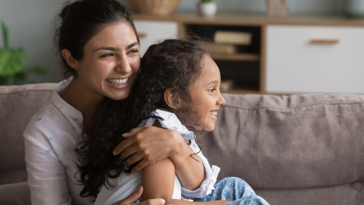 A woman and child laughing together