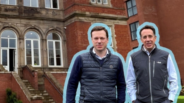 Image of two man in front of building smiling in a blue outline